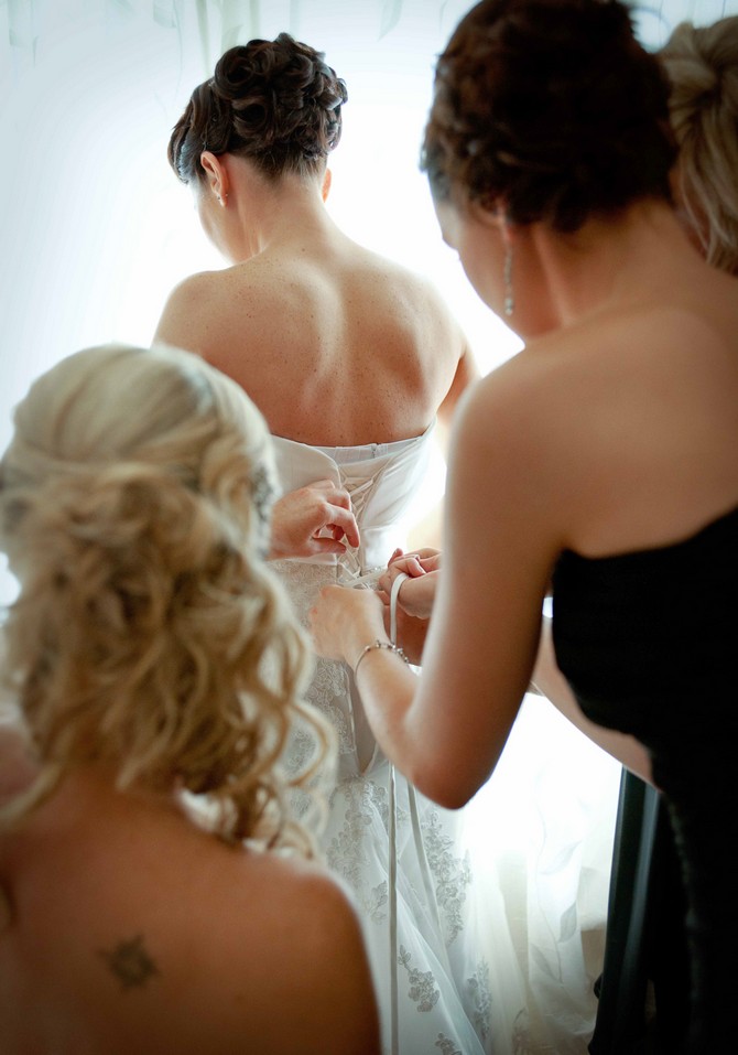 bride getting dress